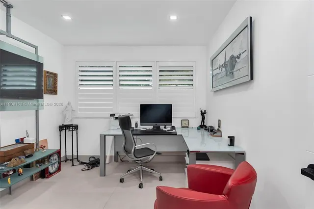 a bedroom with furniture and a book shelf