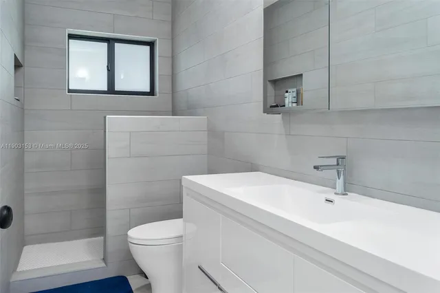 a bedroom with a bed and with flat screen tv