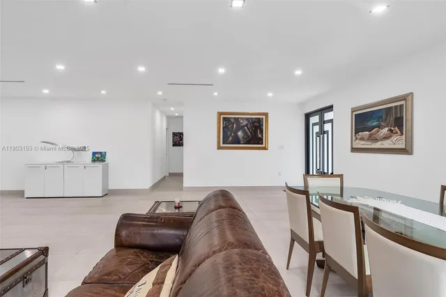 a view of kitchen with cabinets and window