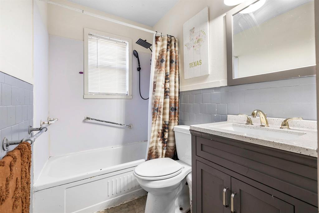 132 Maple Dublin, TX 76446 - Photo 14 of 27 a bathroom with a granite countertop sink toilet and shower