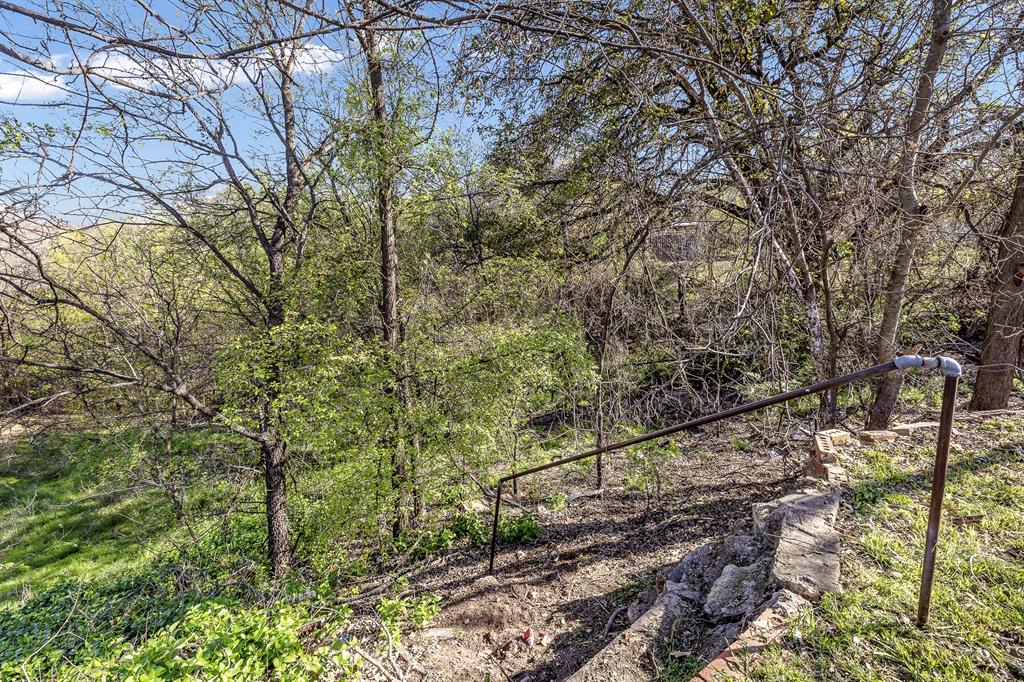 132 Maple Dublin, TX 76446 - Photo 18 of 27 a backyard of a house with lots of green space
