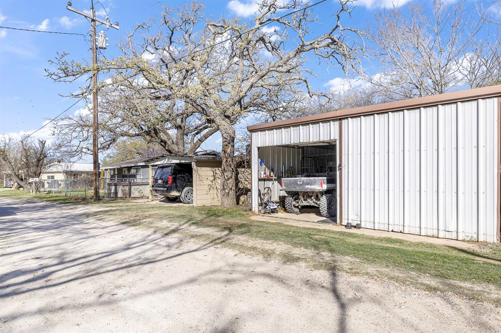 132 Maple Dublin, TX 76446 - Photo 20 of 27 a view of a house with backyard porch and sitting area