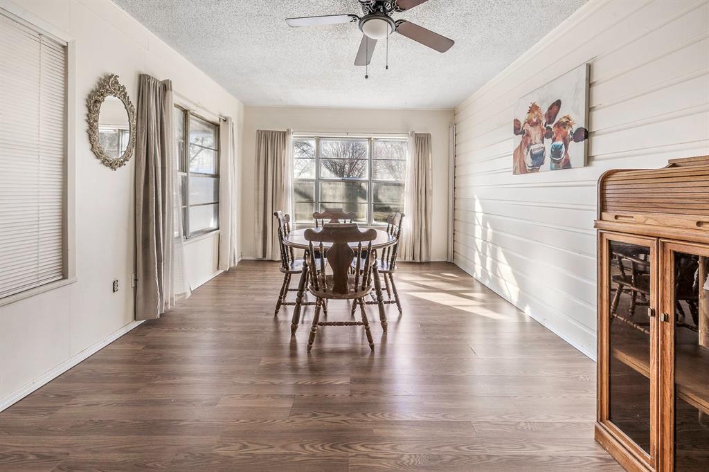 132 Maple Dublin, TX 76446 - Photo 2 of 27 a view of a a dining room with furniture window and wooden floor
