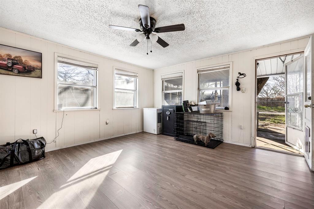 132 Maple Dublin, TX 76446 - Photo 7 of 27 a living room with furniture and wooden floor