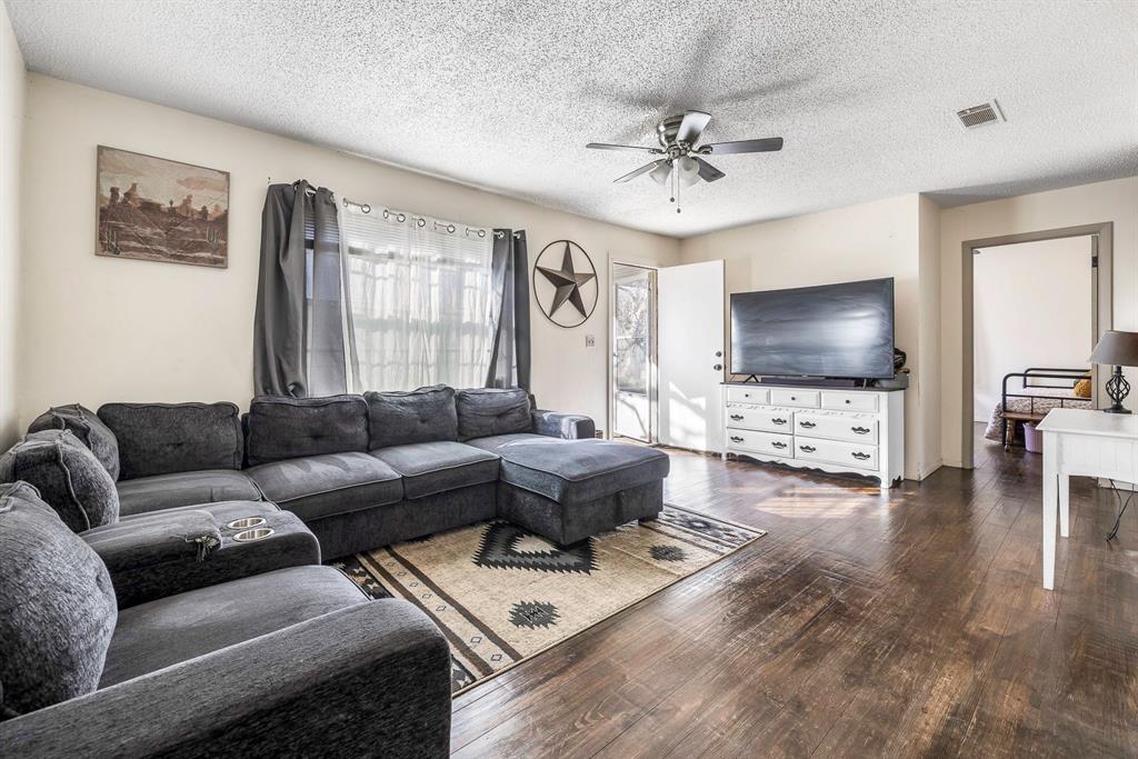 132 Maple Dublin, TX 76446 - Photo 8 of 27 a living room with furniture and a flat screen tv
