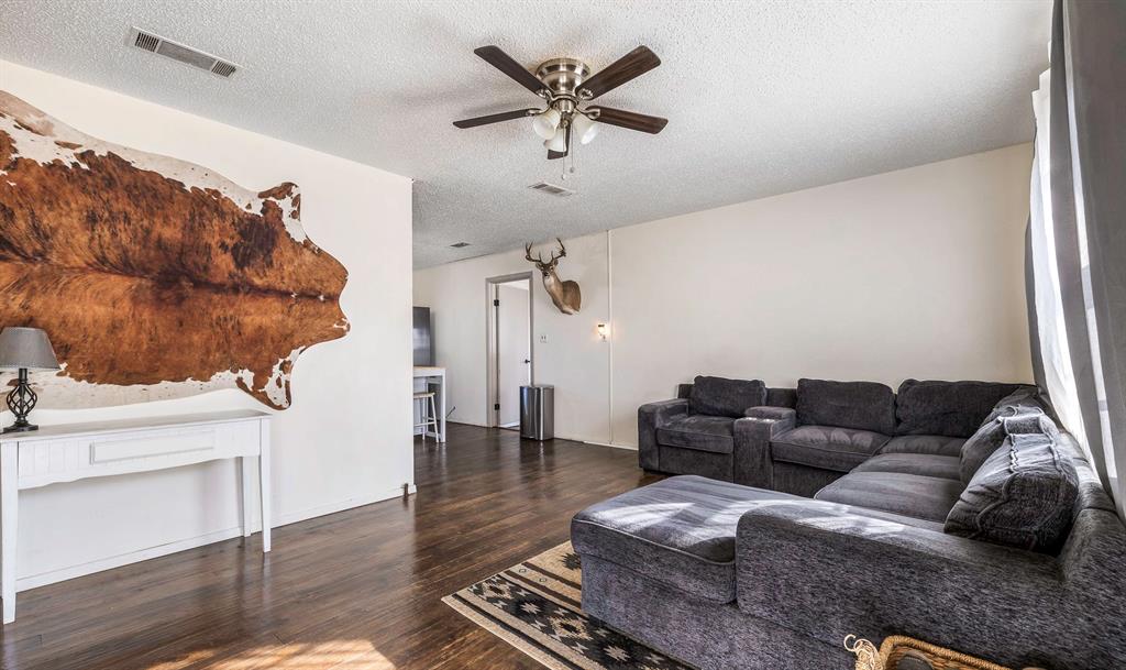132 Maple Dublin, TX 76446 - Photo 9 of 27 a living room with furniture and wooden floor