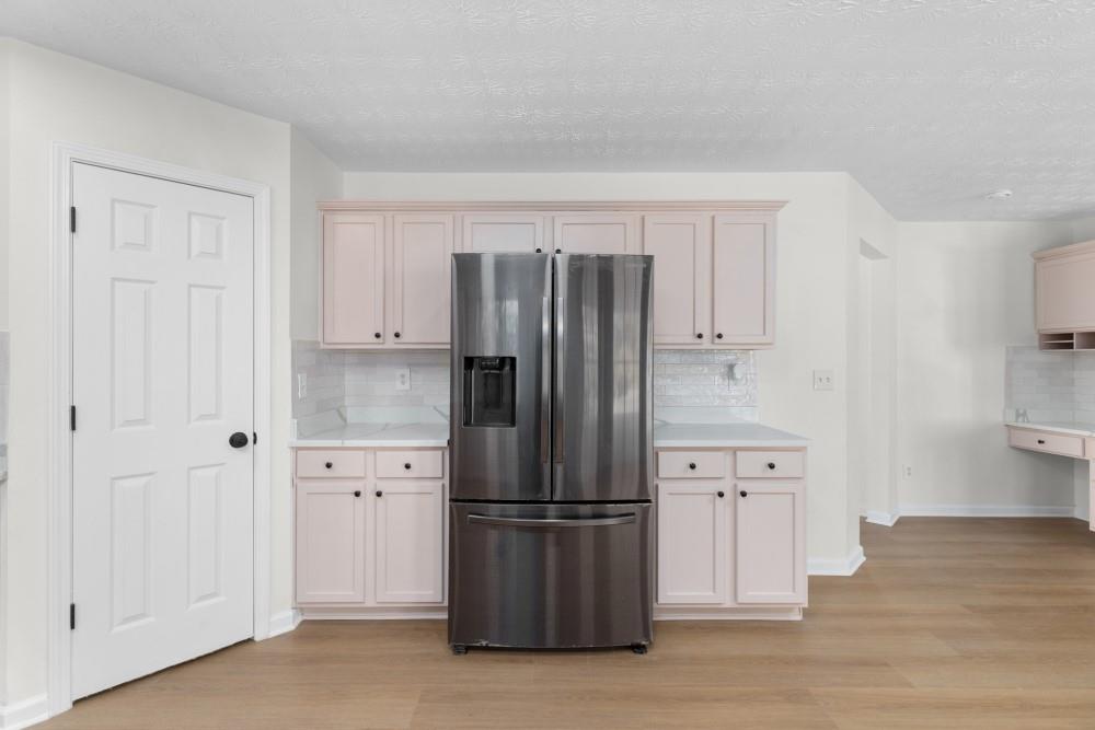 3501 Bogan Mill Road Northeast Buford, GA 30519 - Photo 21 of 59 a kitchen with stainless steel appliances a refrigerator and cabinets