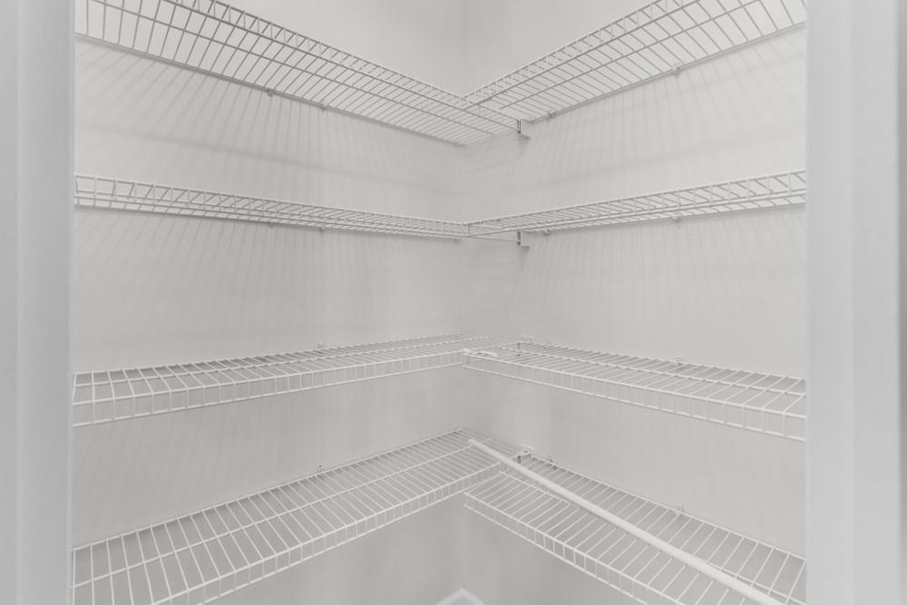 3501 Bogan Mill Road Northeast Buford, GA 30519 - Photo 24 of 59 a view of a room with racks on the wall