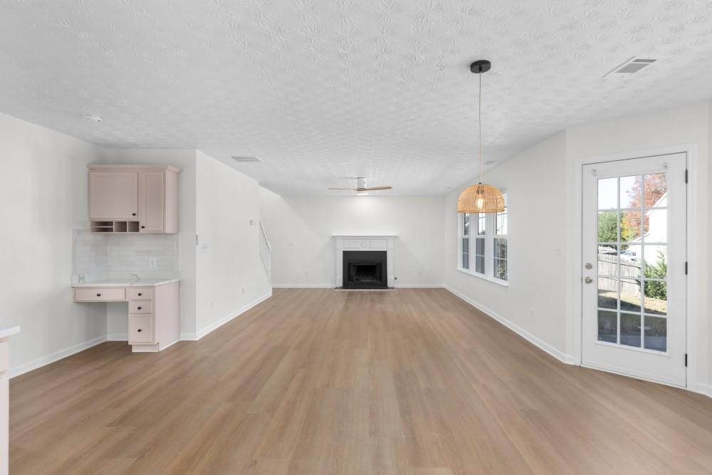 3501 Bogan Mill Road Northeast Buford, GA 30519 - Photo 25 of 59 a view of empty room with wooden floor and fan