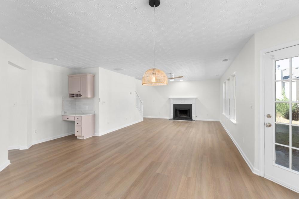 3501 Bogan Mill Road Northeast Buford, GA 30519 - Photo 26 of 59 a view of empty room with wooden floor and window
