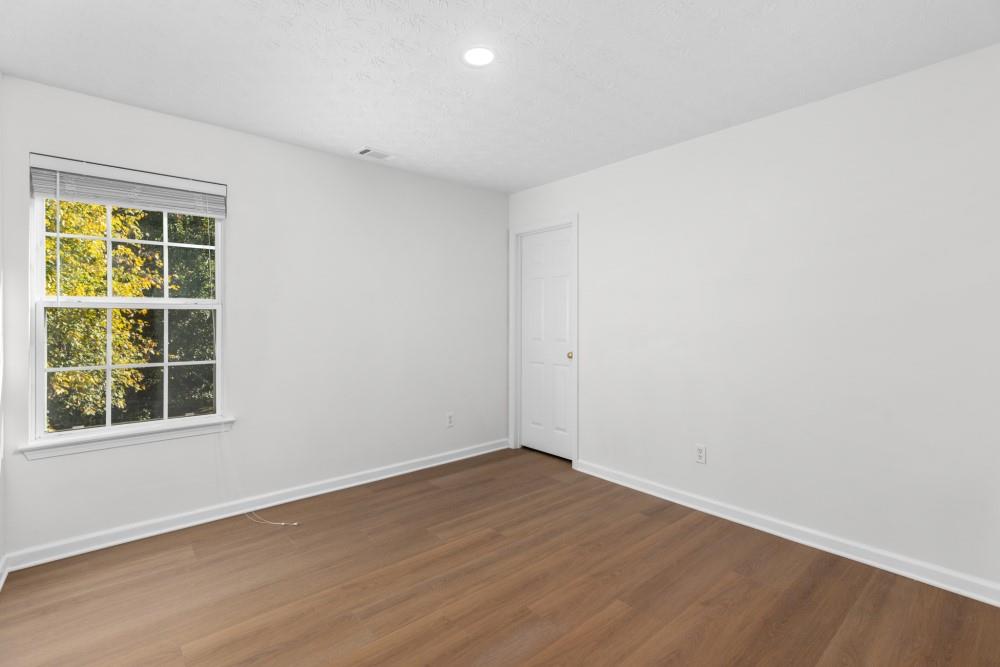 3501 Bogan Mill Road Northeast Buford, GA 30519 - Photo 38 of 59 an empty room with a window