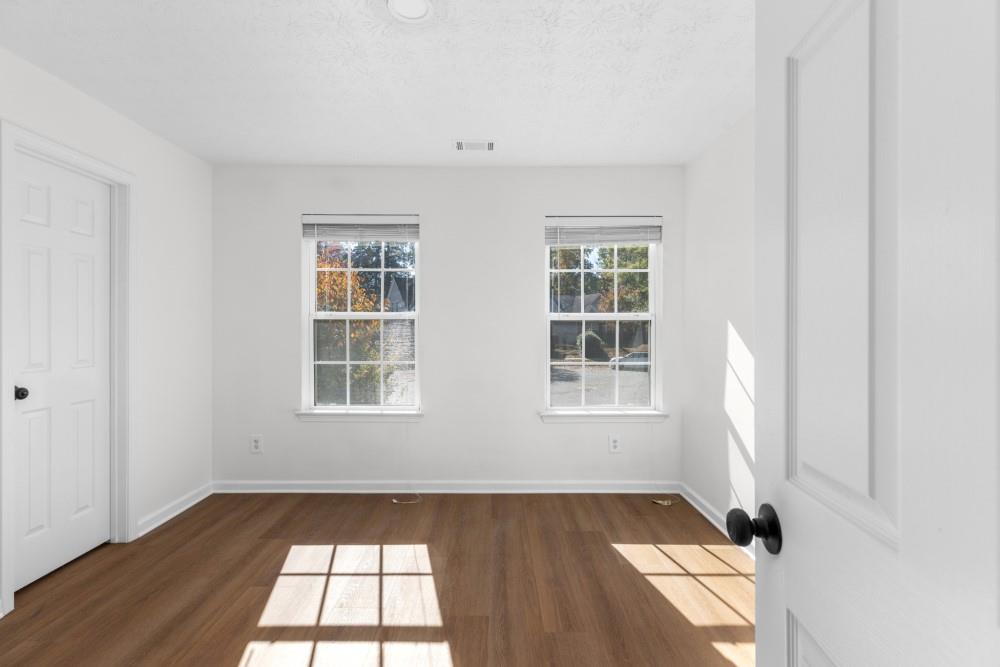 3501 Bogan Mill Road Northeast Buford, GA 30519 - Photo 42 of 59 an empty room with windows