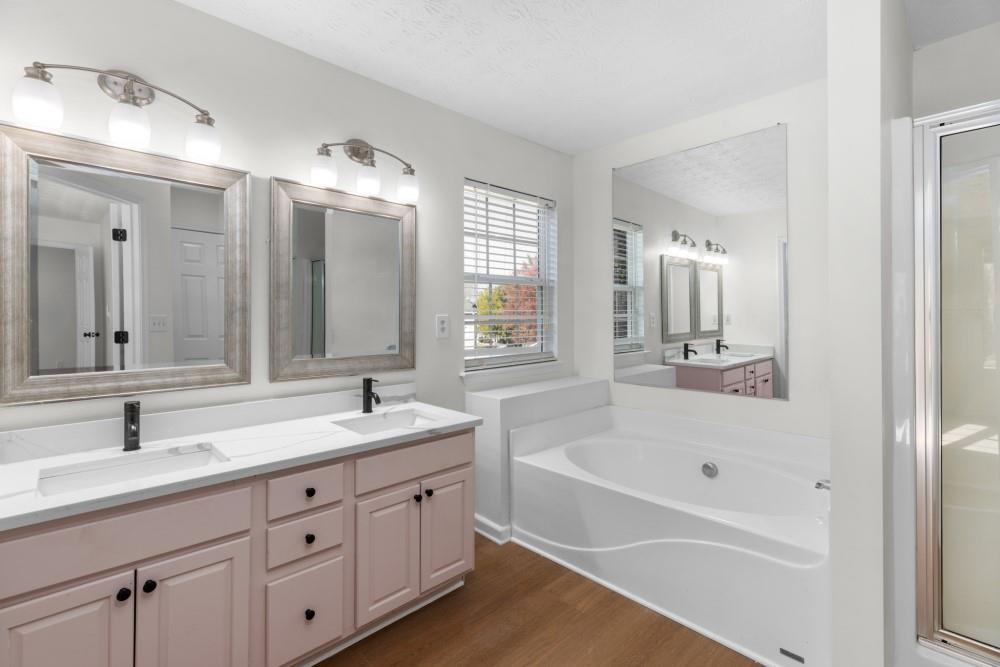 3501 Bogan Mill Road Northeast Buford, GA 30519 - Photo 49 of 59 a bathroom with a tub sink and mirror