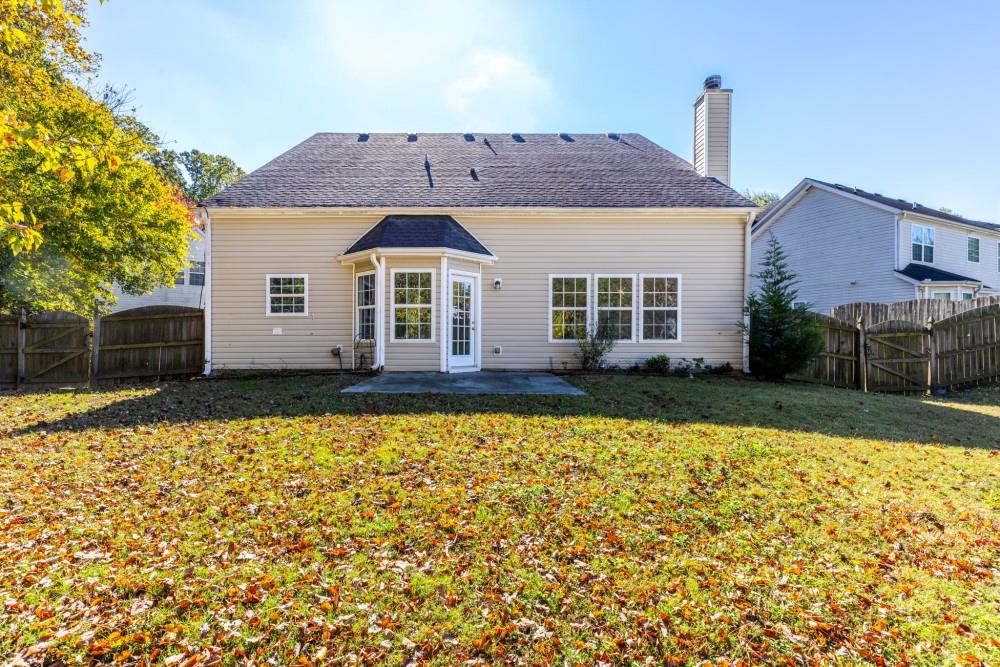 3501 Bogan Mill Road Northeast Buford, GA 30519 - Photo 58 of 59 a front view of a house with a yard