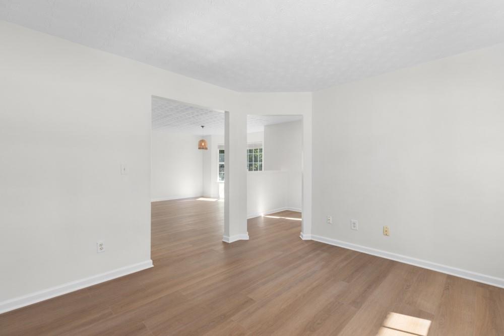 3501 Bogan Mill Road Northeast Buford, GA 30519 - Photo 10 of 59 a view of empty room with wooden floor