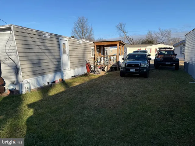 a view of a car park in front of house