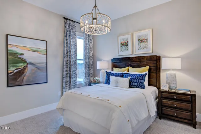 a bed room with a bed and a television