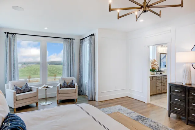 a bathroom with a double vanity sink mirror and shower