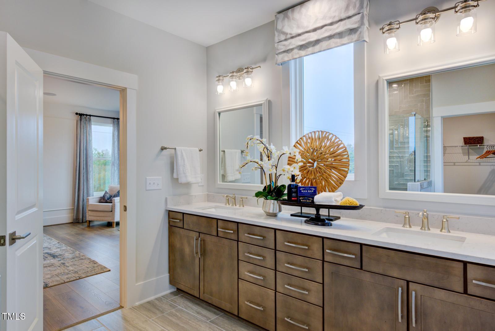 149 Brandy Mill Pittsboro, NC 27312 - Photo 28 of 69 a bathroom with a double vanity sink mirror and shower