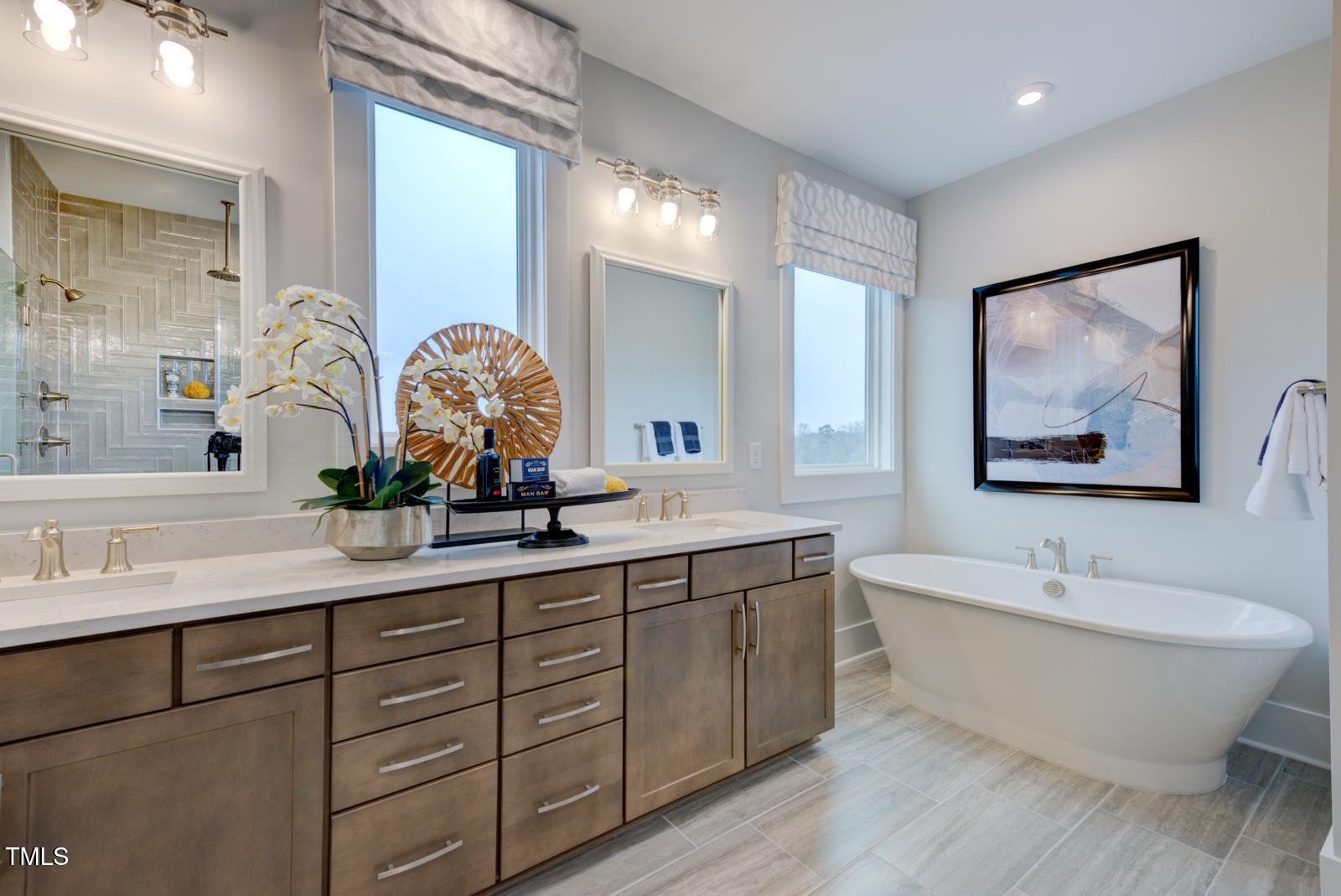 149 Brandy Mill Pittsboro, NC 27312 - Photo 29 of 69 a bathroom with a double vanity sink mirror and bathtub