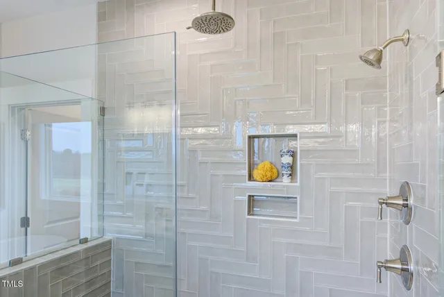 a kitchen with stainless steel appliances granite countertop a stove a sink and a dining table with wooden floor