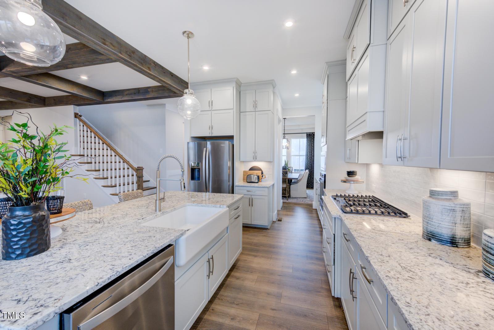 149 Brandy Mill Pittsboro, NC 27312 - Photo 43 of 69 a large kitchen with stainless steel appliances kitchen island granite countertop a lot of counter space