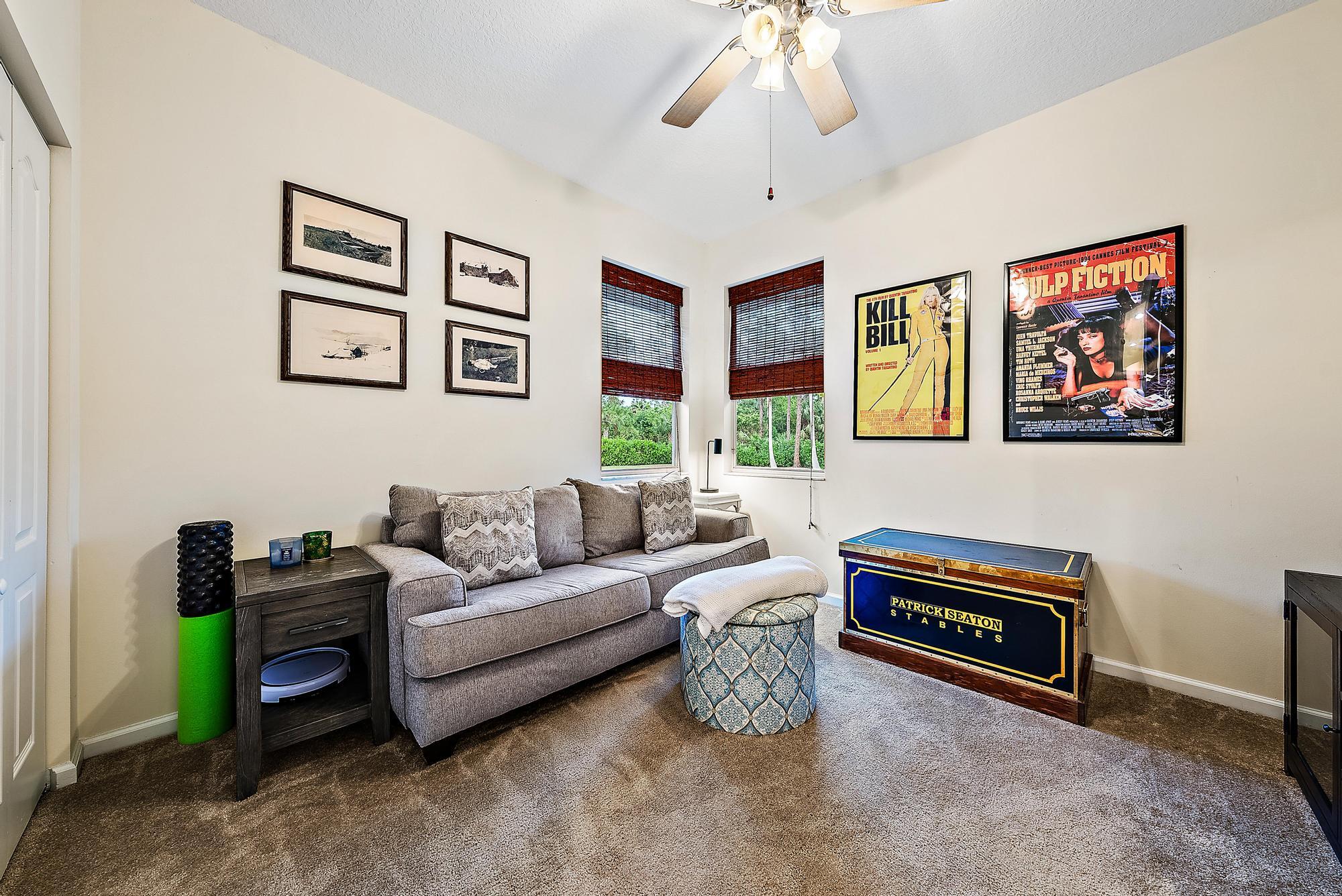 15644 Billy Goat Lane Jupiter, FL 33478 - Photo 25 of 39 a living room with furniture and a piano