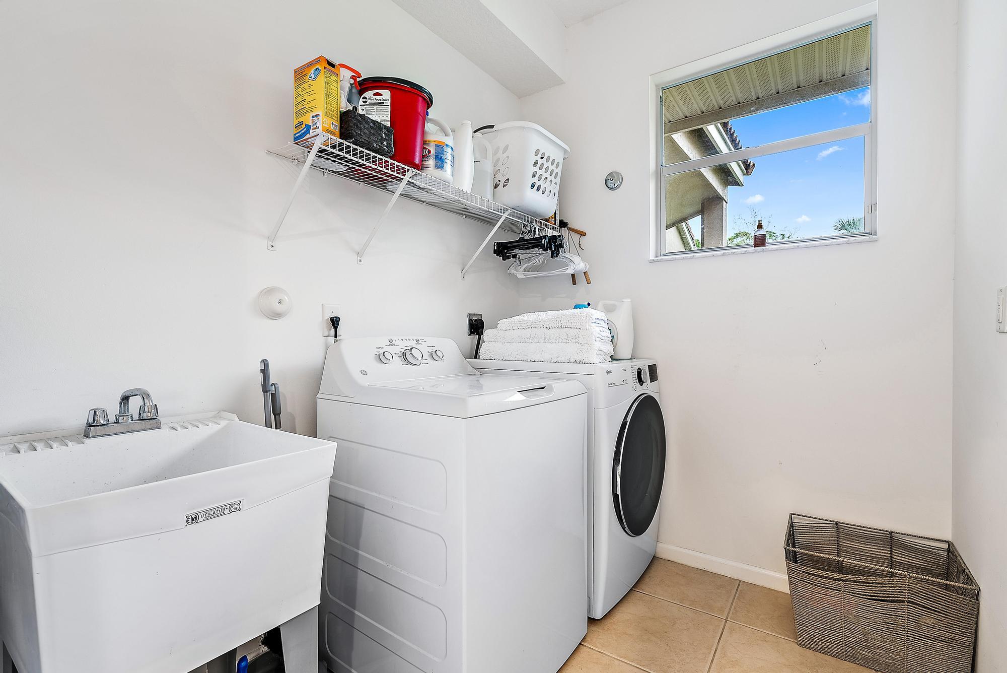 15644 Billy Goat Lane Jupiter, FL 33478 - Photo 26 of 39 a utility room with dryer and washer