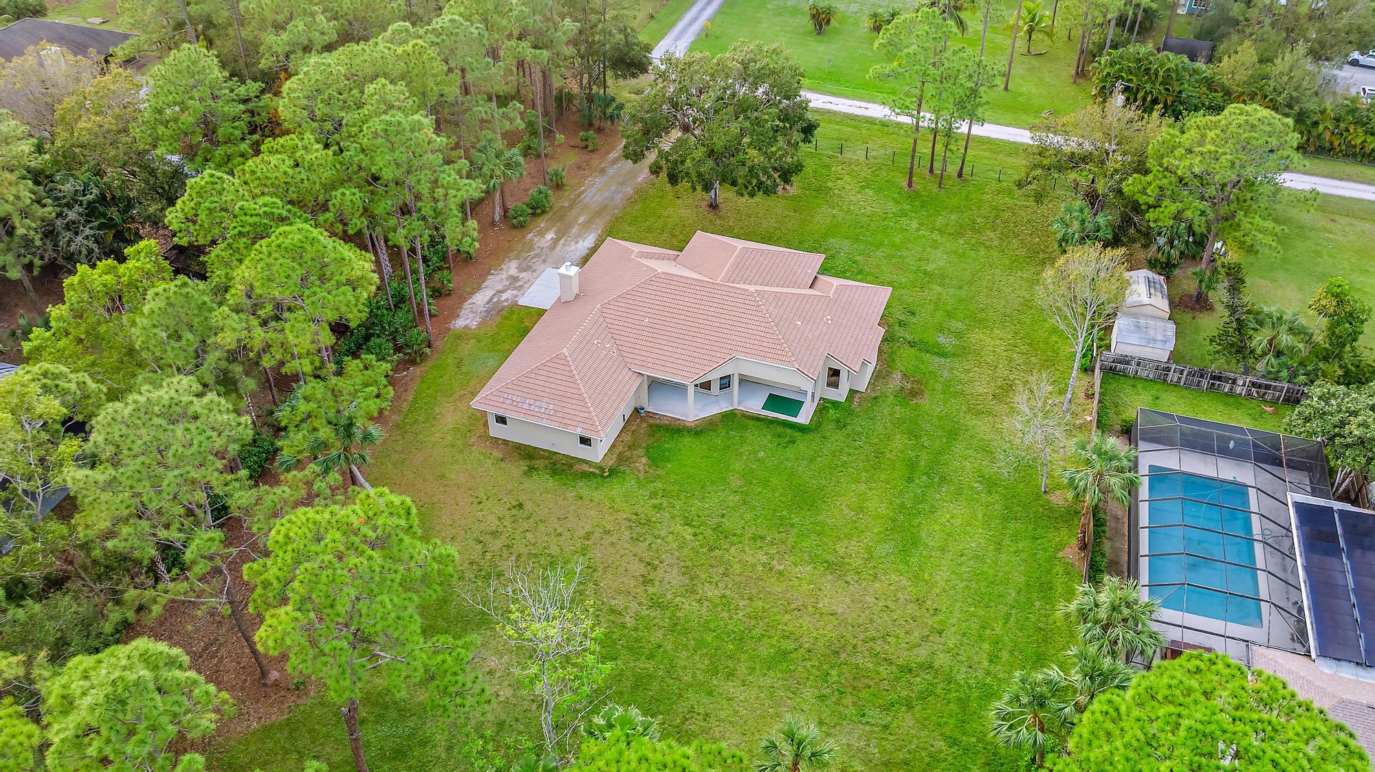 15644 Billy Goat Lane Jupiter, FL 33478 - Photo 36 of 39 an aerial view of a house