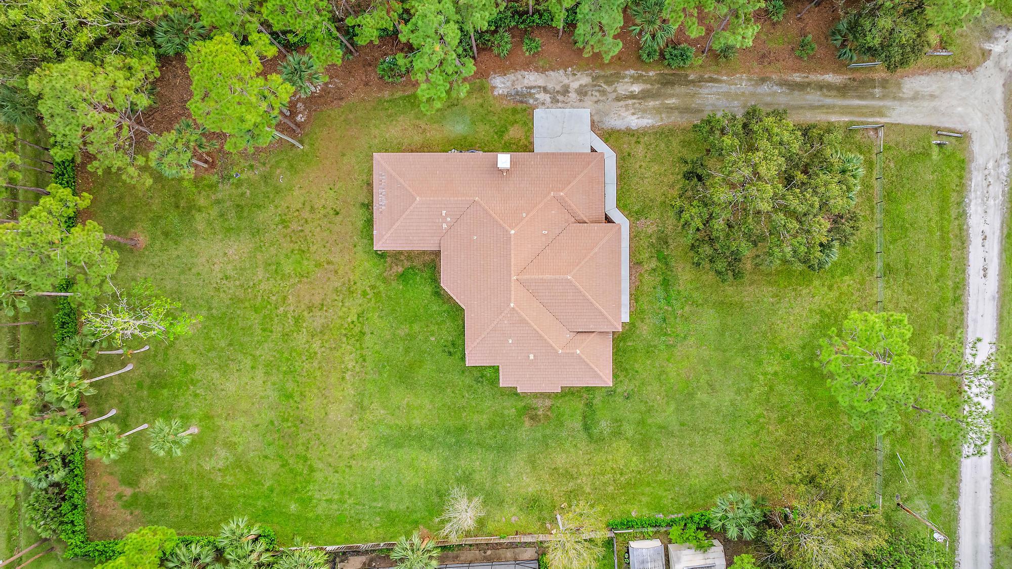 15644 Billy Goat Lane Jupiter, FL 33478 - Photo 39 of 39 an aerial view of residential house with an outdoor space and seating