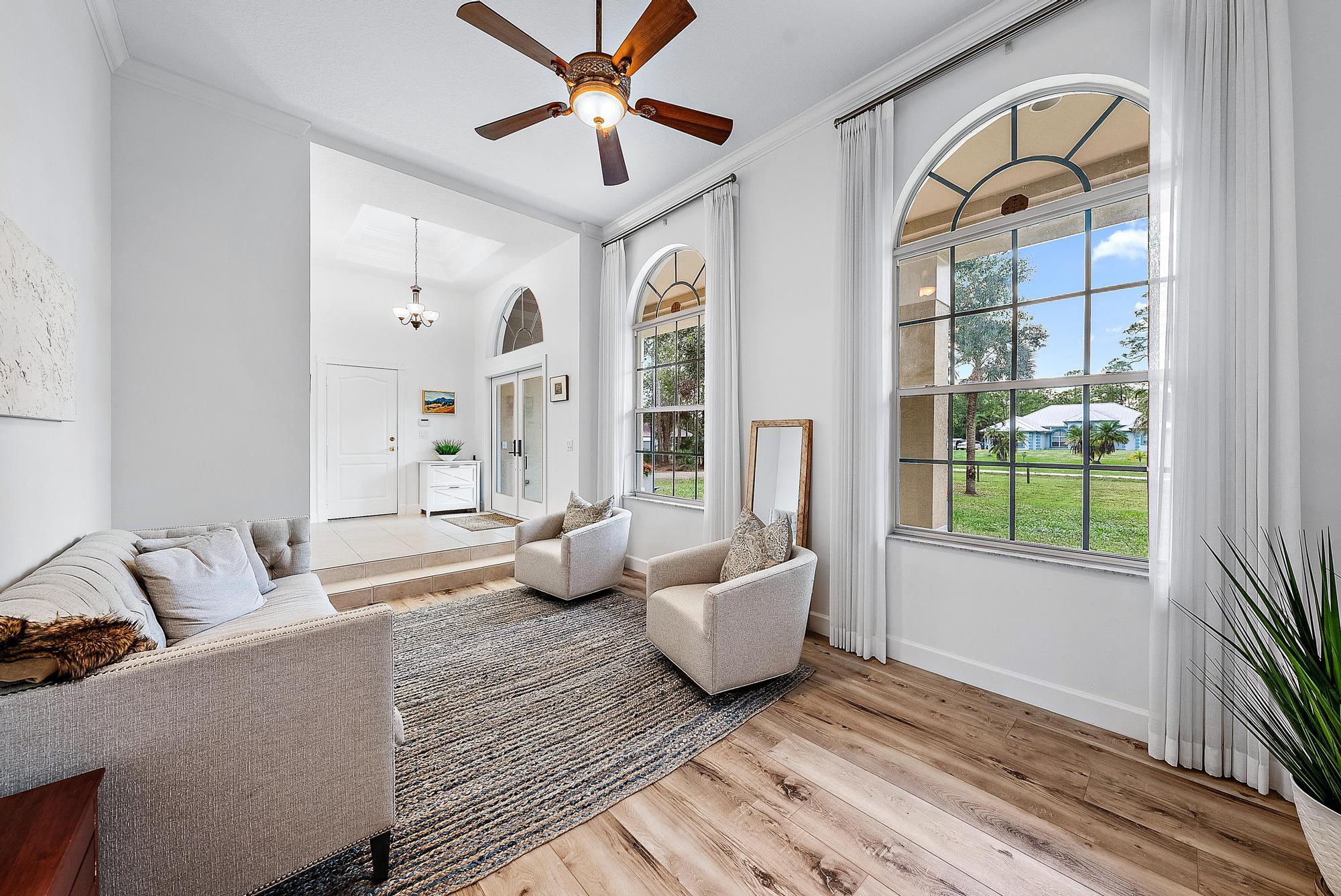 15644 Billy Goat Lane Jupiter, FL 33478 - Photo 6 of 39 a living room with furniture and a window