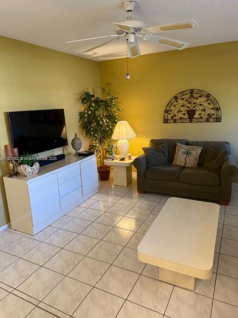 5300 Washington Street, Unit P136 Hollywood, FL 33021 - Photo 2 of 21 a living room with furniture and a flat screen tv