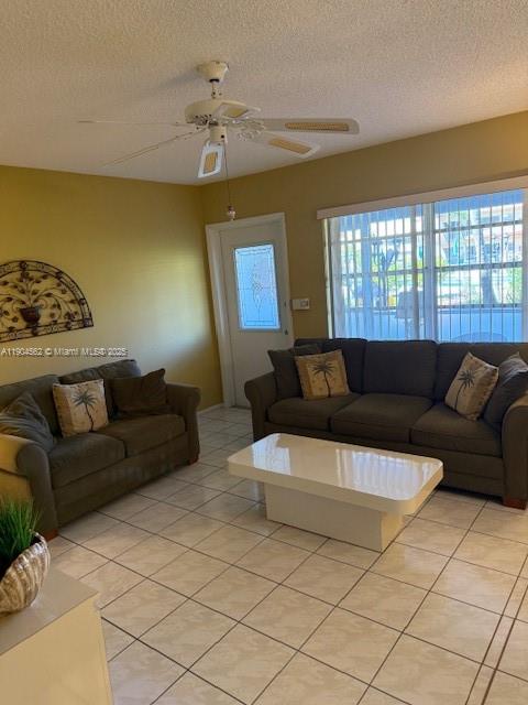 5300 Washington Street, Unit P136 Hollywood, FL 33021 - Photo 3 of 21 a living room with furniture and a large window