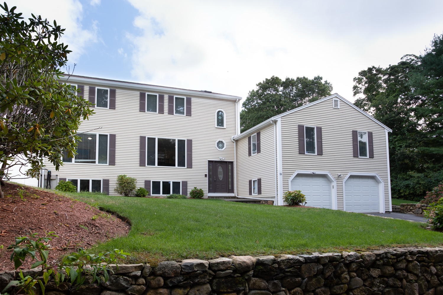 104 Goose Point Road Centerville, MA 02601 - Photo 1 of 41 a front view of a house with a garden and yard