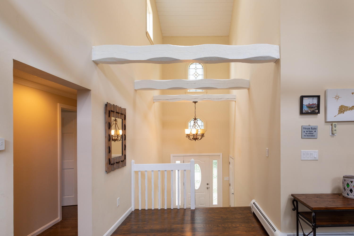 104 Goose Point Road Centerville, MA 02601 - Photo 12 of 41 a view of a hallway with wooden floor and dining room