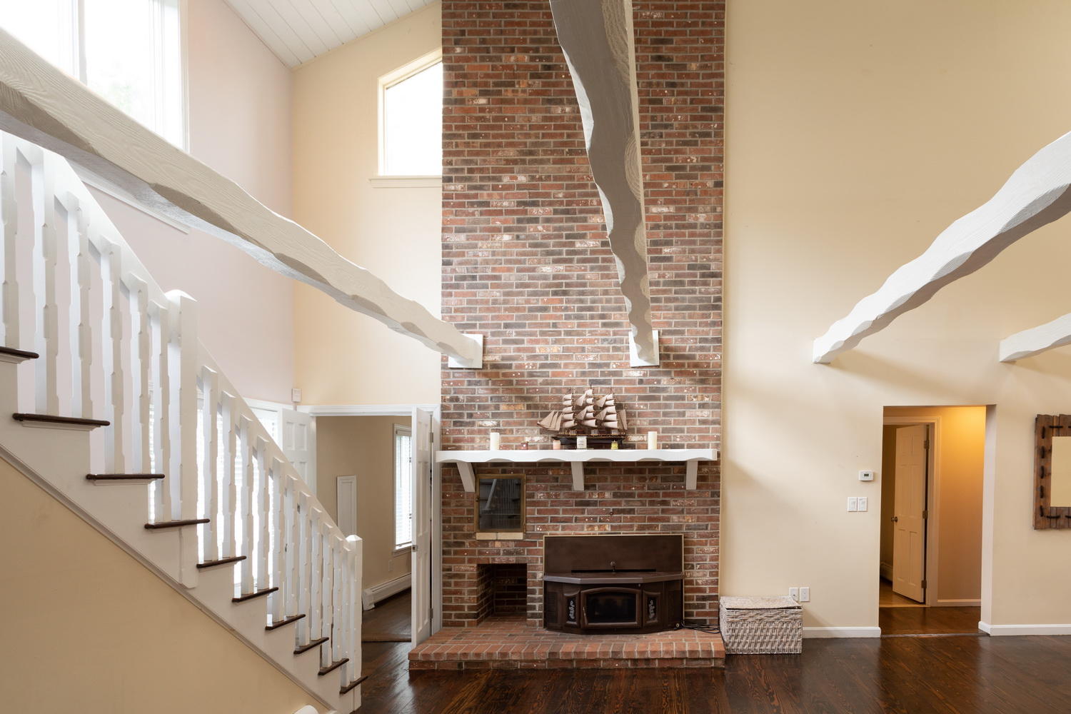 104 Goose Point Road Centerville, MA 02601 - Photo 20 of 41 a view of a livingroom with wooden floor and a fireplace