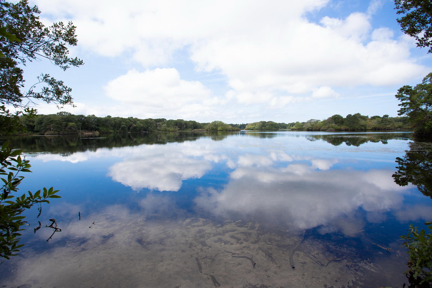 104 Goose Point Road Centerville, MA 02601 - Photo 2 of 41 a view of a lake with houses in the background