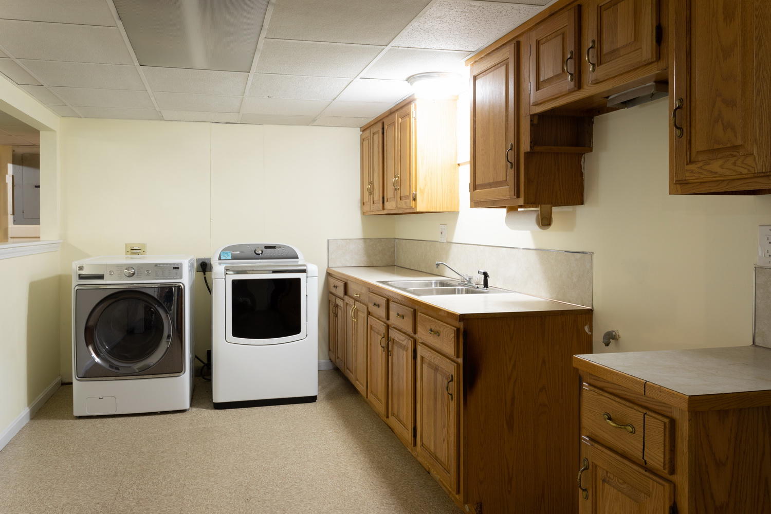 104 Goose Point Road Centerville, MA 02601 - Photo 40 of 41 a utility room with sink dryer and washer