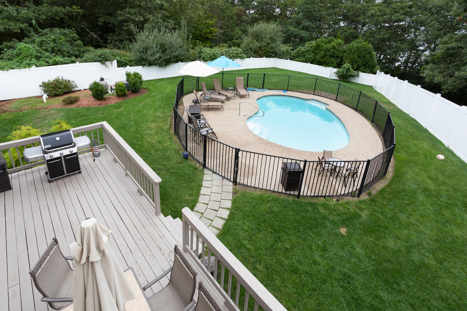 104 Goose Point Road Centerville, MA 02601 - Photo 9 of 41 a view of a roof deck with table and chairs a barbeque