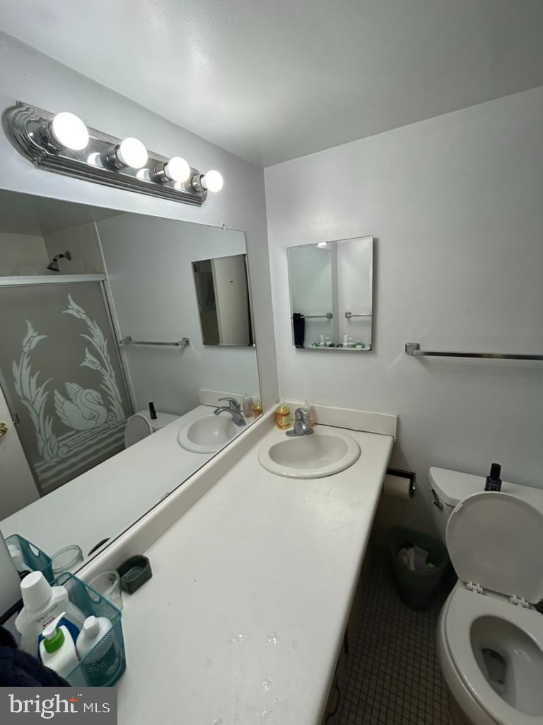 950 25th Street Northwest, Unit 503N Washington, DC 20037 - Photo 12 of 28 a bathroom with a sink and a mirror