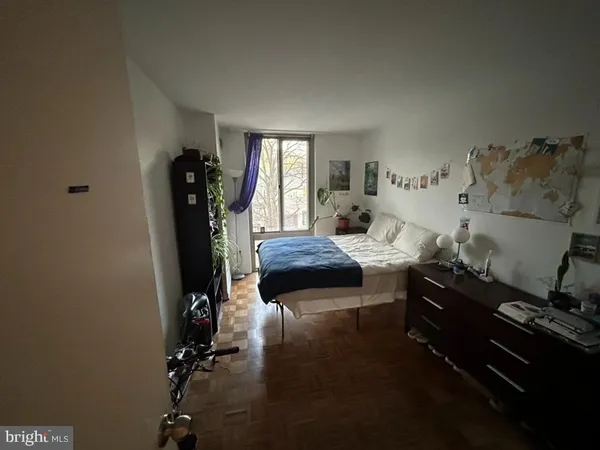 a living room with furniture rug and window