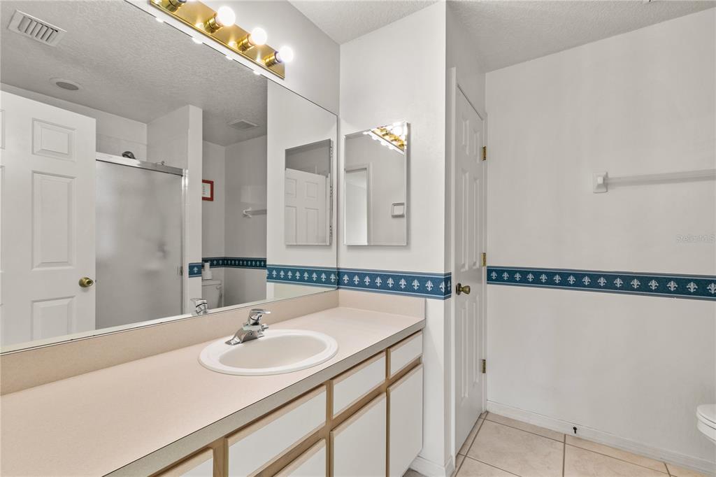 2714 Bayview Drive Eustis, FL 32726 - Photo 11 of 35 a bathroom with a sink and a mirror