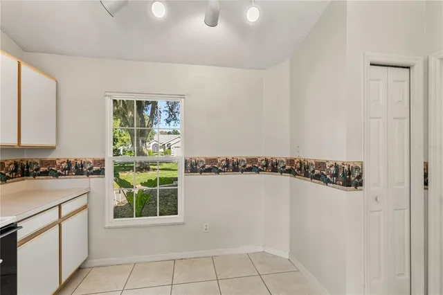 a view of a kitchen with a sink and dishwasher with a white countertops
