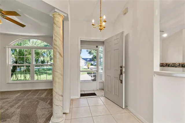 a view of an entryway with a chandelier