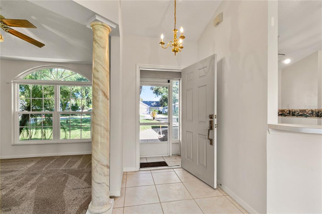 2714 Bayview Drive Eustis, FL 32726 - Photo 3 of 35 a view of an entryway with a chandelier