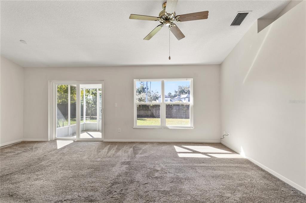 2714 Bayview Drive Eustis, FL 32726 - Photo 4 of 35 a view of an empty room with a window