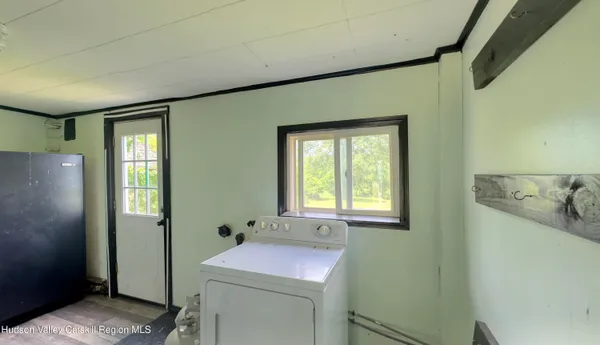 a bathroom with a sink and mirror with toilet