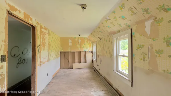 a view of a hallway with windows
