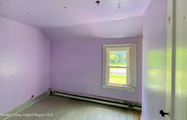 a room with window and a bed