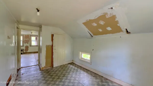 a view of an empty room and window